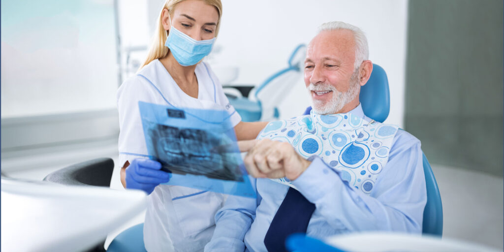 denture patient talking to dentist