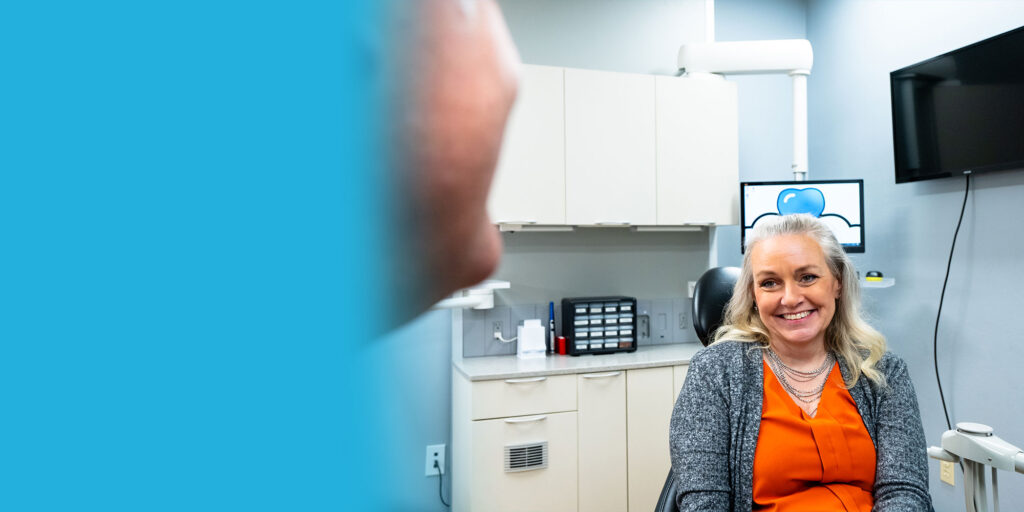 Dr. R. Benjamin Scott and patient talking to each other