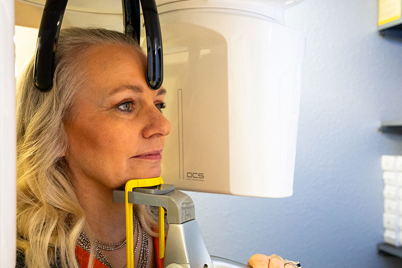 patient going through a teeth x-ray