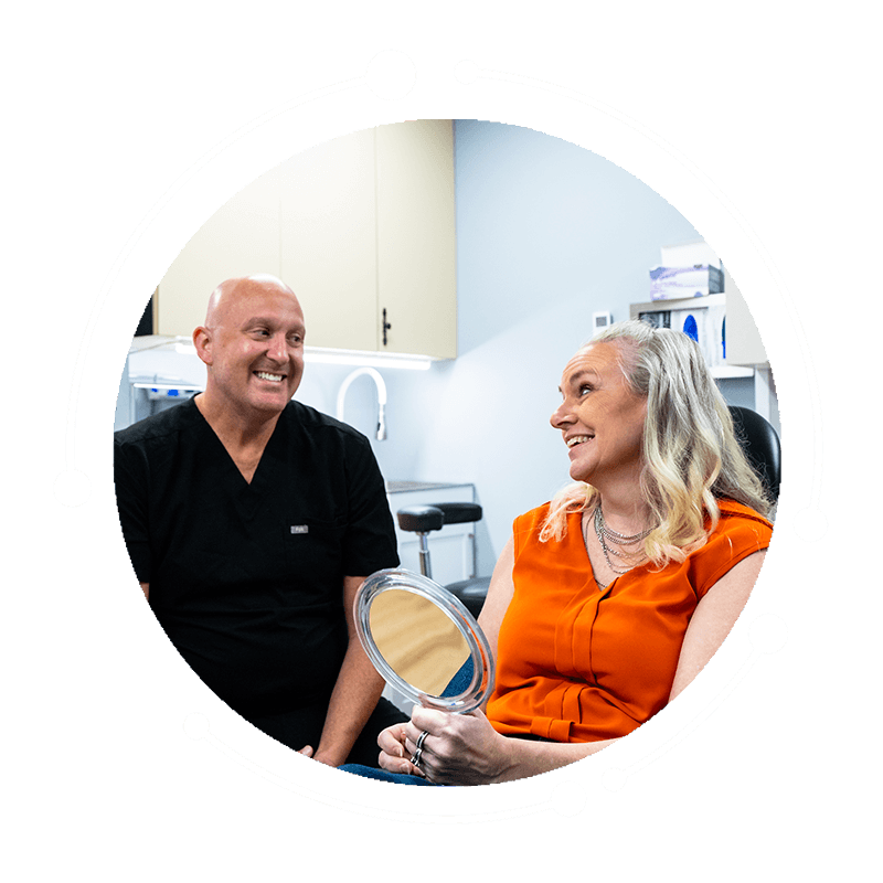Dr. R. Benjamin Scott smiling with patient